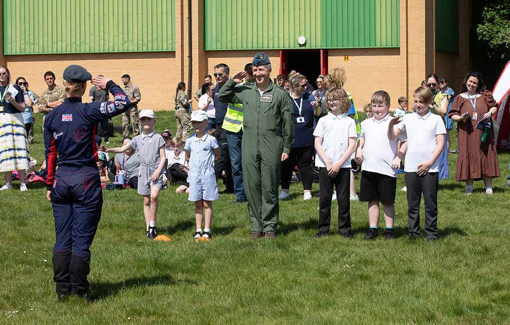 Officer Commanding RAF Falcons, Flight Lieutenant Adams-Cairns slautes Group Captain McIntyre post display jump